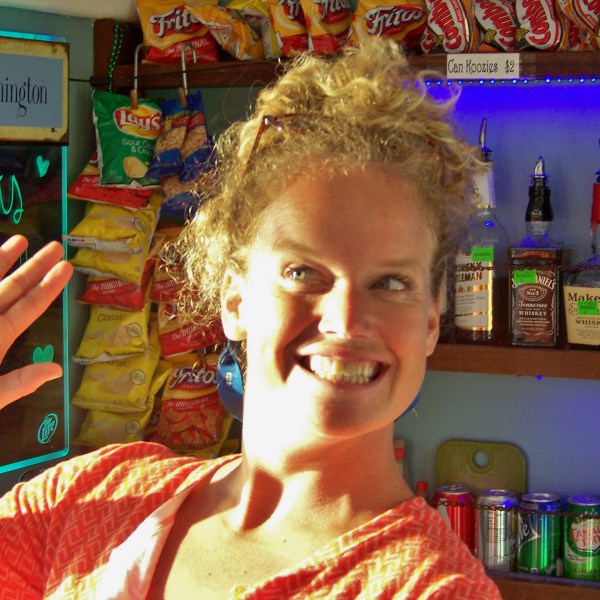 a woman standing in front of a store