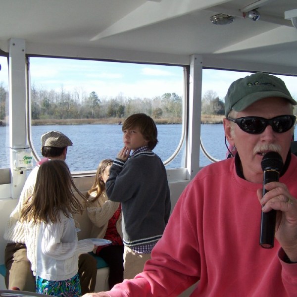 a man drinking out of a window