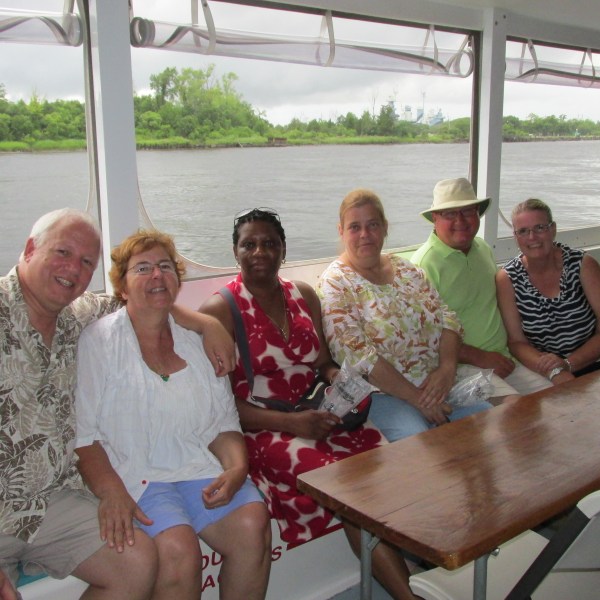 a group of people sitting at a picnic table