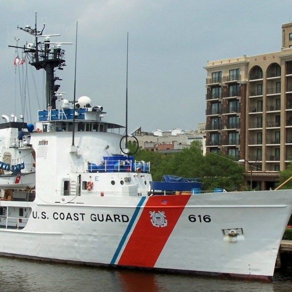 a boat is docked next to a body of water