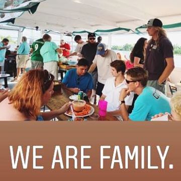 a group of people standing in front of a crowd