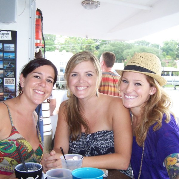 a man and a woman standing in front of a cake