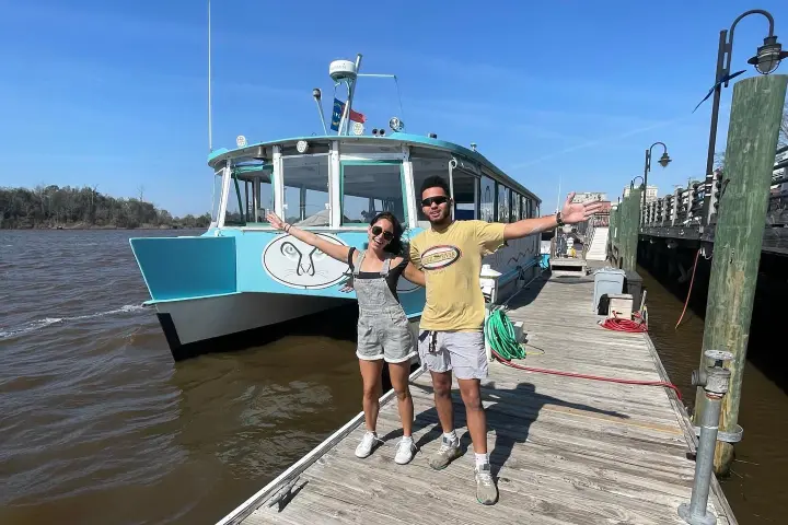 a group of people on a boat in the water
