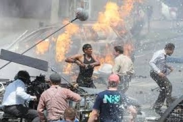 a group of people sitting around a fire