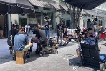 a group of people walking down a street